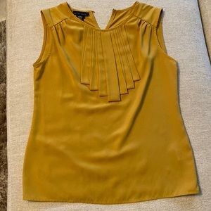 Yellow tank with embellishments